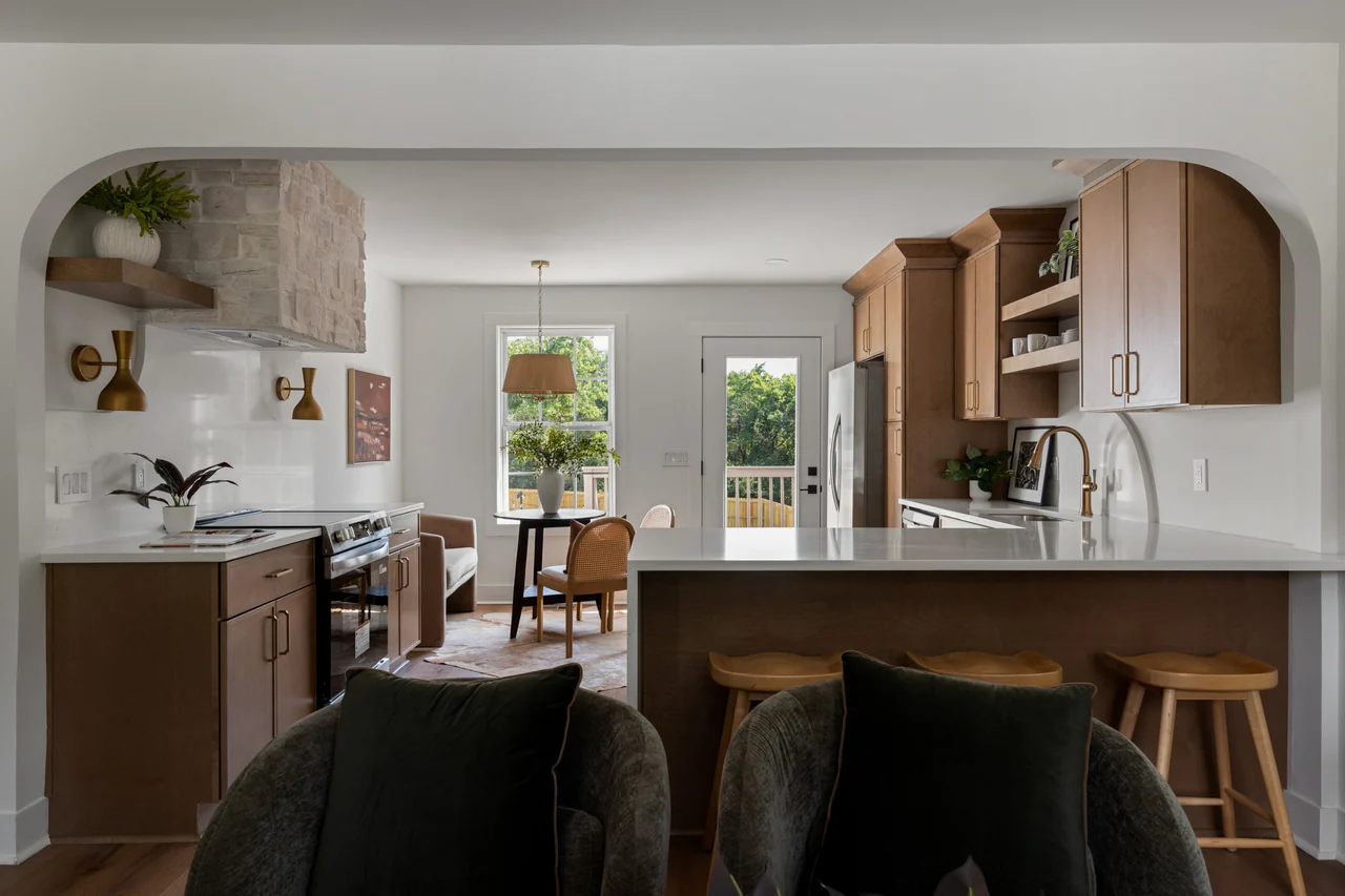 Arched opening framing the kitchen and dining nook
