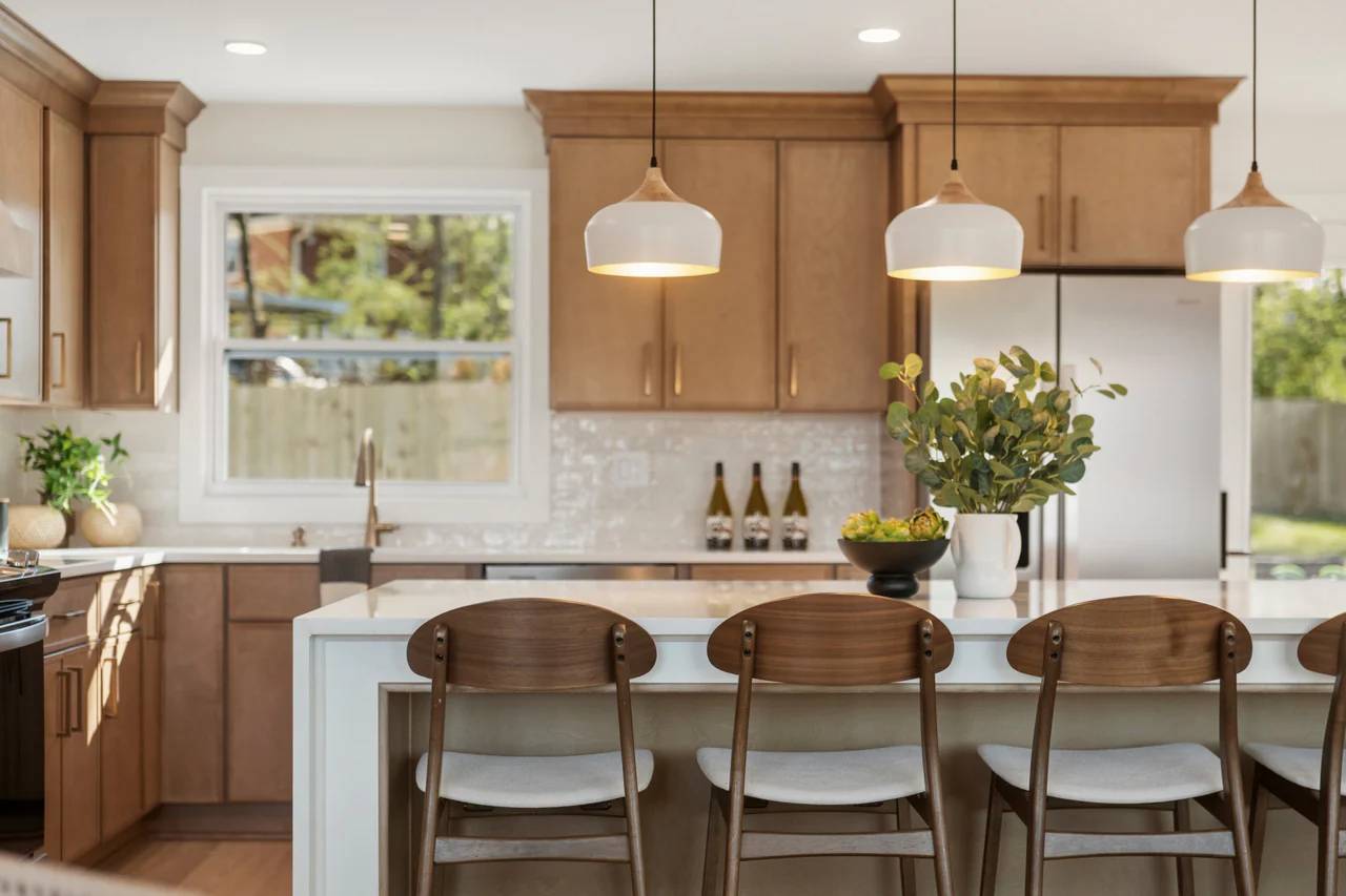Close view of island stools and pendant lights