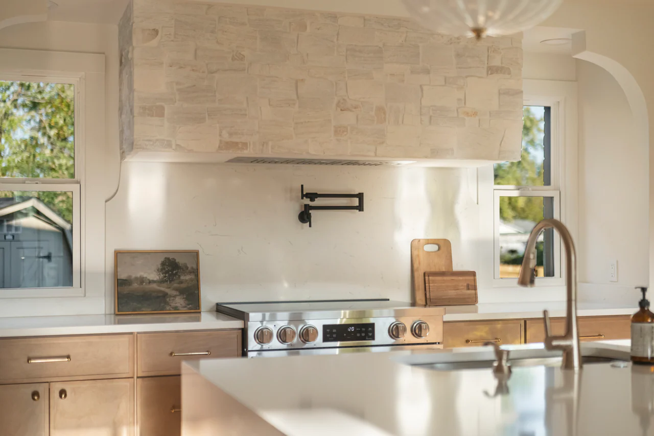 Stone range hood, pot filler and range